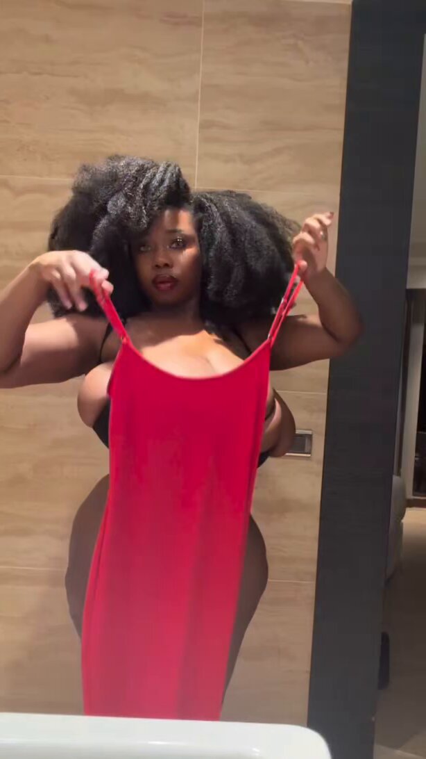 Holding up the red dress
